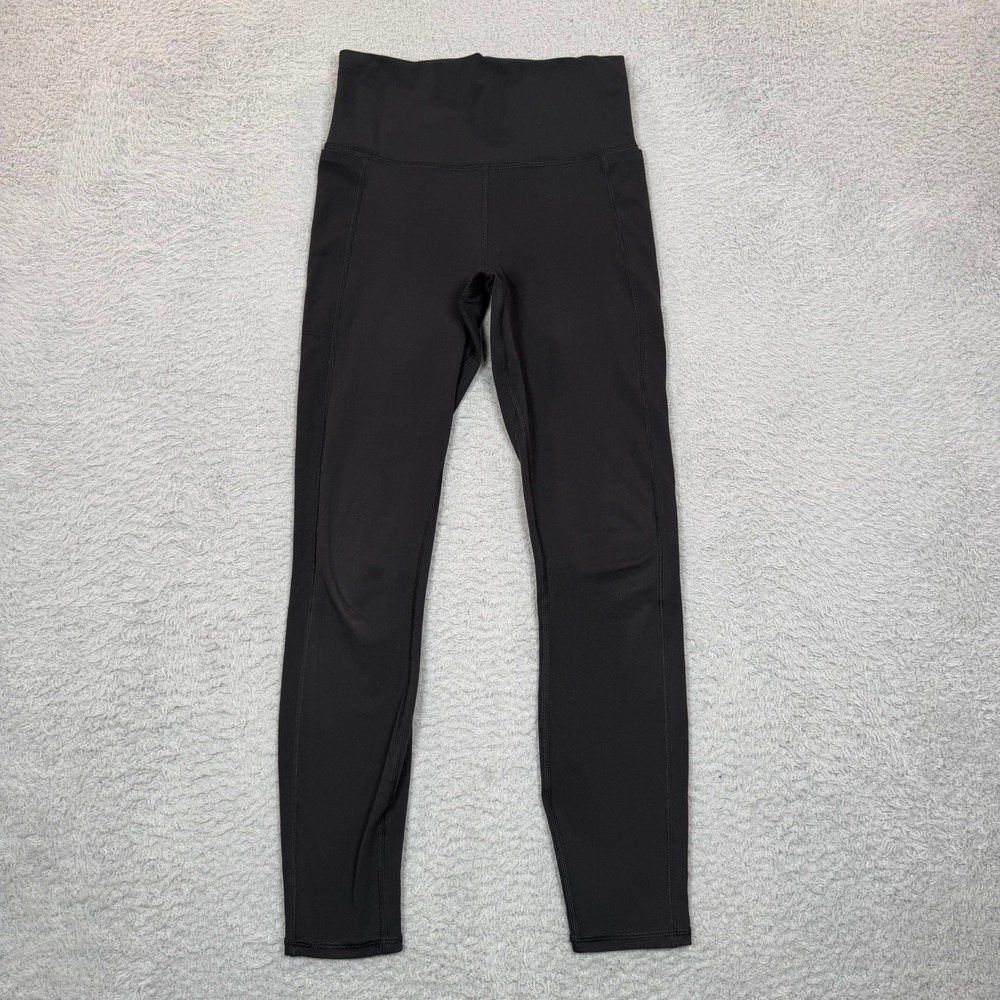Vuori Womens High Rise Performance Leggings Black Side Pockets Size XS 25 Inseam